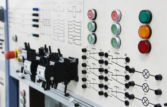 Control panels in an electronics labOblique angle view of a long row of control panels in an electronics lab