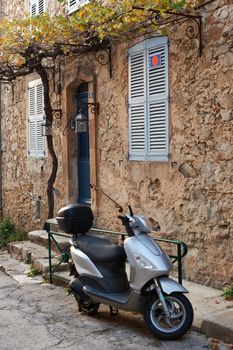 Typical Saint Tropez street with moped, Provence, France