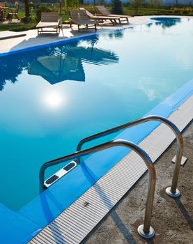 Swimming pool detail with clear water and blue color