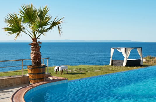 Blue water of swimming pool and the Black sea shore near Sozopol town, Bulgaria