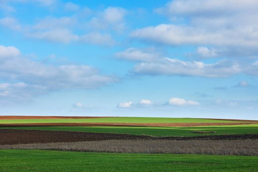 Farmers land and blue sky in late autumn season