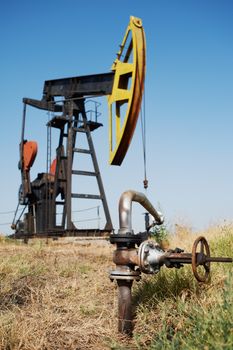 Oil pump and close-up of pipe to trasport the petrol