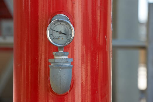 Manometer on inustry pipe to measure water pressure