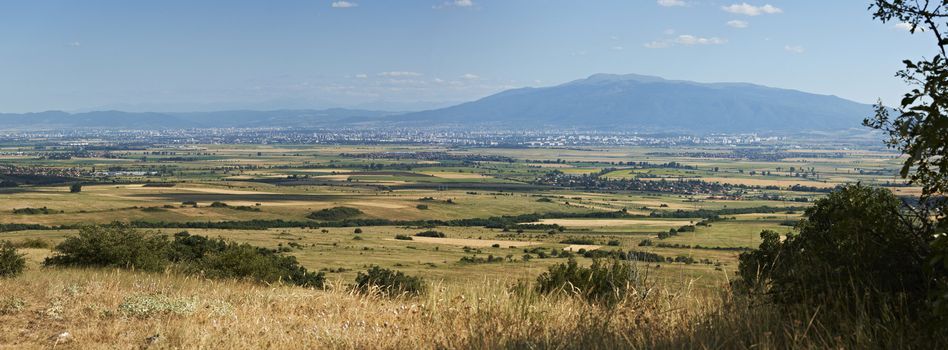 Large panorama of Sofia valley and Vitosha mountain, Bulgaria from the ridges of Stara planina