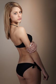 Young model woman, pretty tall girl posing in studio