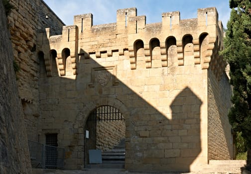 Wall and main gate of the Luberon castle in France, Provence region