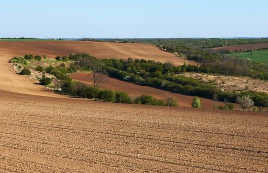 Cultivated land in North Bulgaria early spring season ready for crops