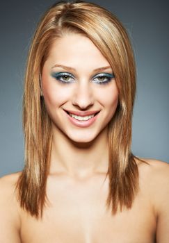 Beauty headshot of model girl young woman with blond hair and healthy skin