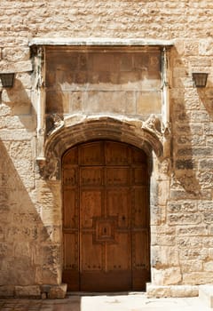 Ancient wooden door of medieval buildings in Aix en Provence, France