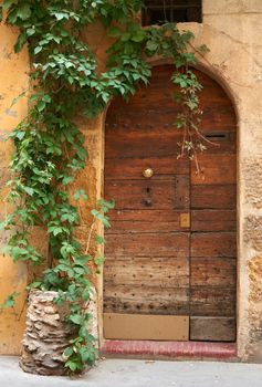 Old medieval wooden door in the old part of Aix en Provence town, South France