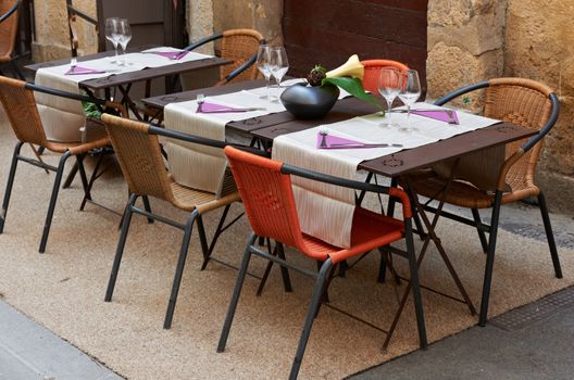 Tables of a small restaurant in Aix en Provence town, South France