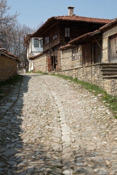 Stone paved street in spring season Zheravna village, Bulgaria