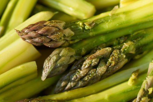 Boiled and salted green asparagus sprouts ready to be served salted