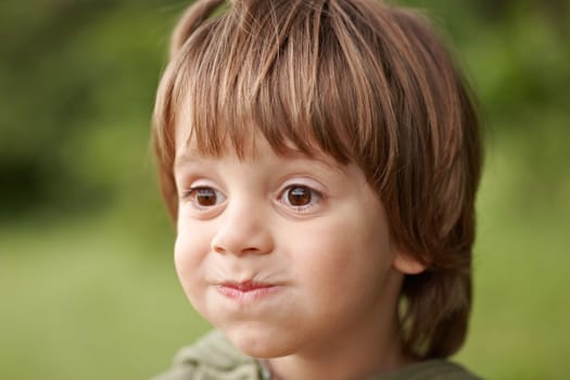 Little cute boy making funny face