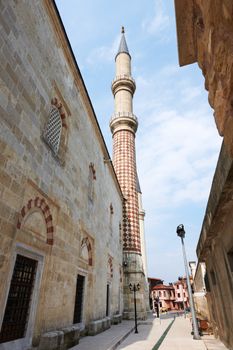 Narrow street in Edirne, Turkey with minaret of Sherifili mosque