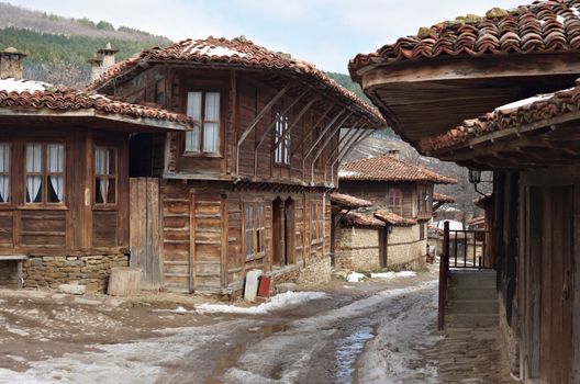 Street with old wooden houses in Zheravna village, Bulgaria