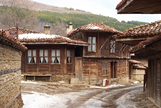 Street with old wooden houses in Zheravna village, Bulgaria