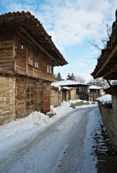 Street with old wooden houses in Zheravna village, Bulgaria