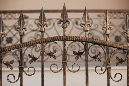 Close-up detail of a wrought iron fence