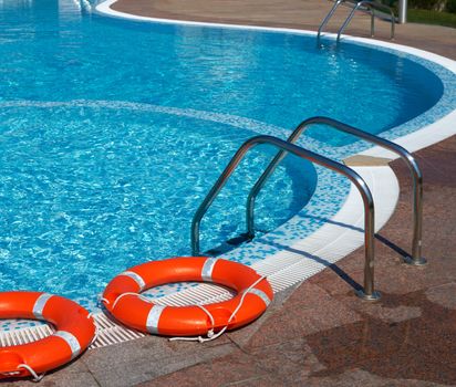 Life-belts near the water of a pool