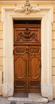 Traditional wooden door in Aix en Provence, France