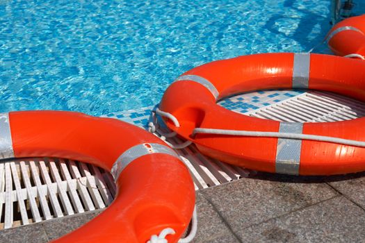 Life-belts near the water of a pool