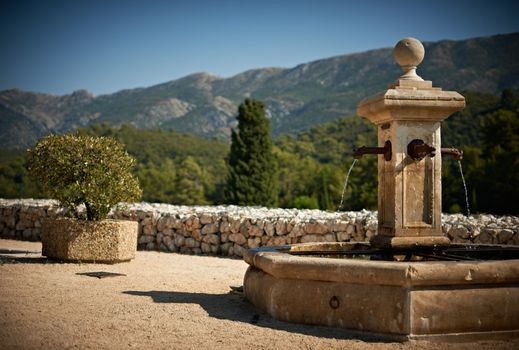 Old fountain in the village of Vauvenargues, French Provnece