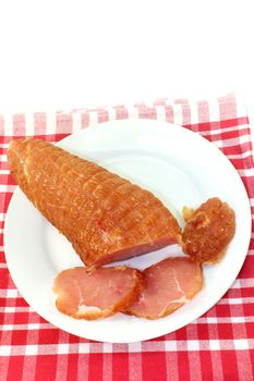 a piece of turkey fillet of salmon in front of white background