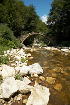 Stone bridge and mountain stream near the cave of Yagodina, Bulgaria