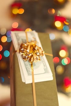 Gift box and US dollar bills