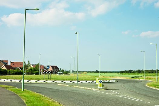 Modern road and roundabout in rural England