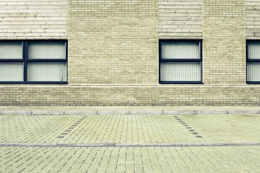 Empty parking space outside a modern office building