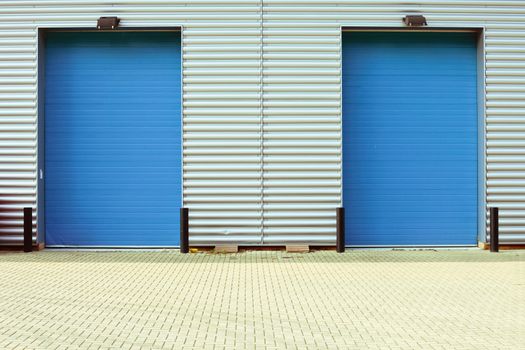 Two blue factory doors as a background
