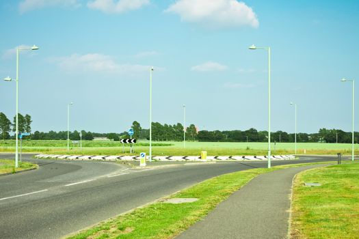 Modern road and roundabout in rural England