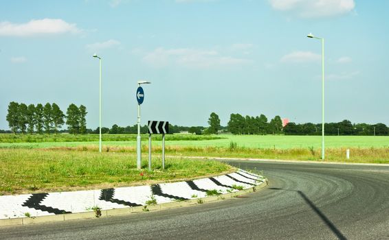 Modern road and roundabout in rural England