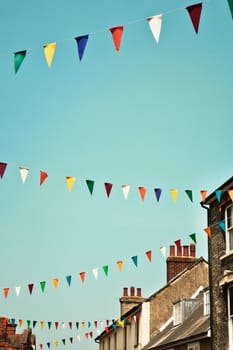 Bunting against a blue summer sky in a UK town