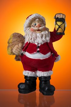 Santa Claus figure on a background of orange spots