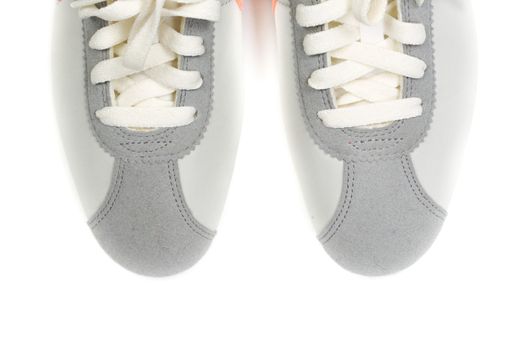 Sporting gray shoes, the front part. Isolated on white