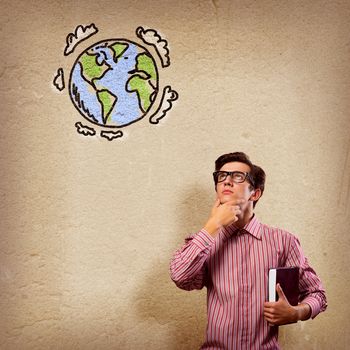 young man with a book thinks. it over symbol planet Earth