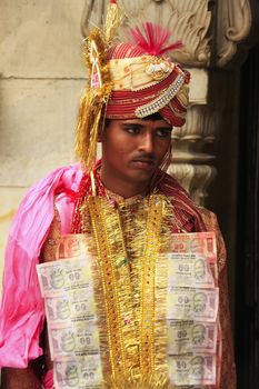 Man taking part in wedding ceremony at Karni Mata Temple, Deshnok, Rajasthan, India