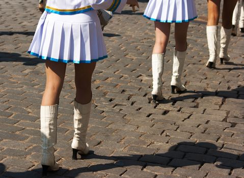 drummer girls legs on city day on sunny summer day