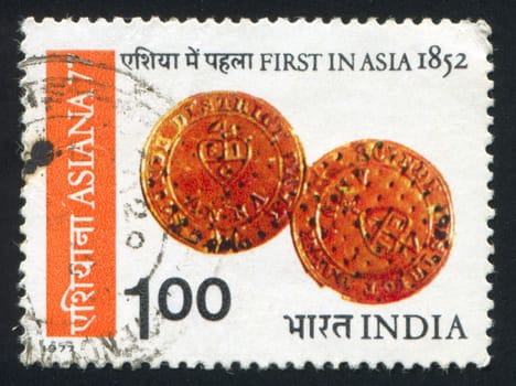 INDIA - CIRCA 1977, stamp printed by India, shows First in Asia 1852, coins, circa 1977