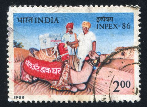 INDIA - CIRCA 1986: stamp printed by India, shows camel, mailbox, men, desert, circa 1986