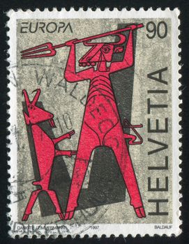 SWITZERLAND - CIRCA 1997: stamp printed by Switzerland, shows Devil and Billy Goat from Legend of the "Devil's Bridge", circa 1997