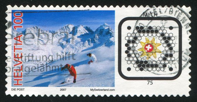 SWITZERLAND - CIRCA 2007: stamp printed by Switzerland, shows Skiers and Swiss Post BeeTagg, circa 2007