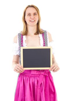 Woman in dirndl shows blank chalkboard