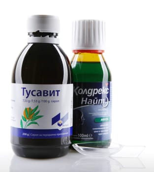 AYTOS, BULGARIA - JANUARY 28, 2014: Liquid medicine in glass bottle - Tusavit, Coldrex Nite.