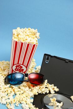 A 3D home movie experience with popcorn and glasses.