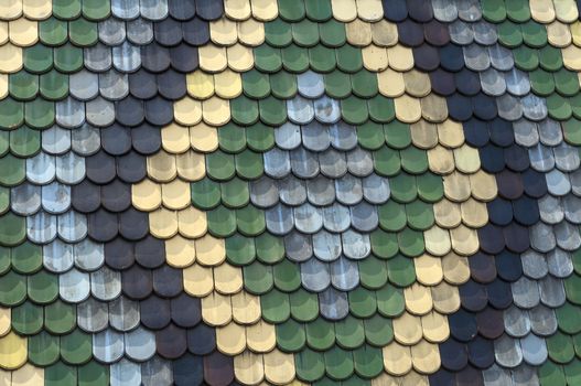 Detailed view of colorful wooden roof shingles.