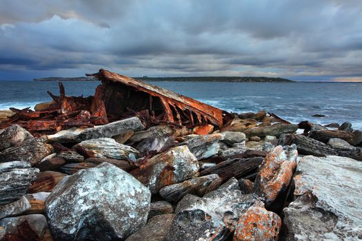 The Scottish built 75 metre ship SS Minmi, became shipwrecked in stormy foggy weather at Cape Banks Headland, Botany Bay.   This is the view of the stern section of the ship on the inside of Cape Banks. A difficult, perilous and risky  rescue ensued of the crew, not all were saved due to the heavy seas.   For more details of the incident  http://www.michaelmcfadyenscuba.info/viewpage.php?page_id=70